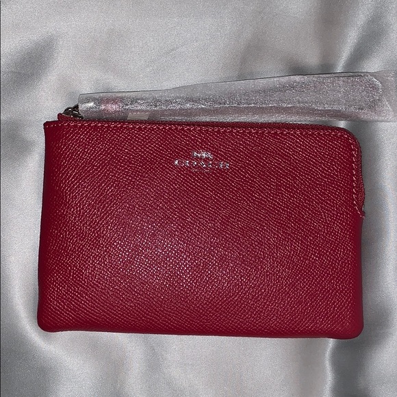 Coach Handbags - Dark pink Corner Zip Wristlet
